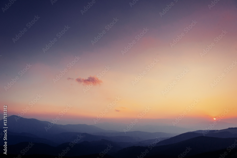 colorful sky with sun background in mountains. sunset, sunrise