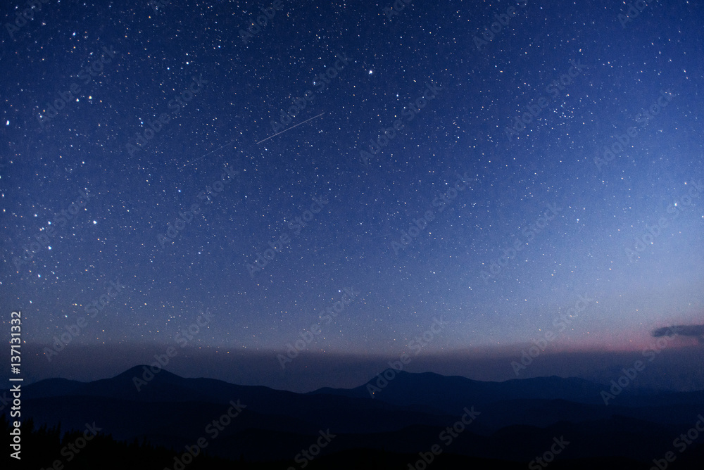 fantastic winter meteor shower and the snow-capped mountains. fantastic winter meteor shower and the snow-capped mountains.