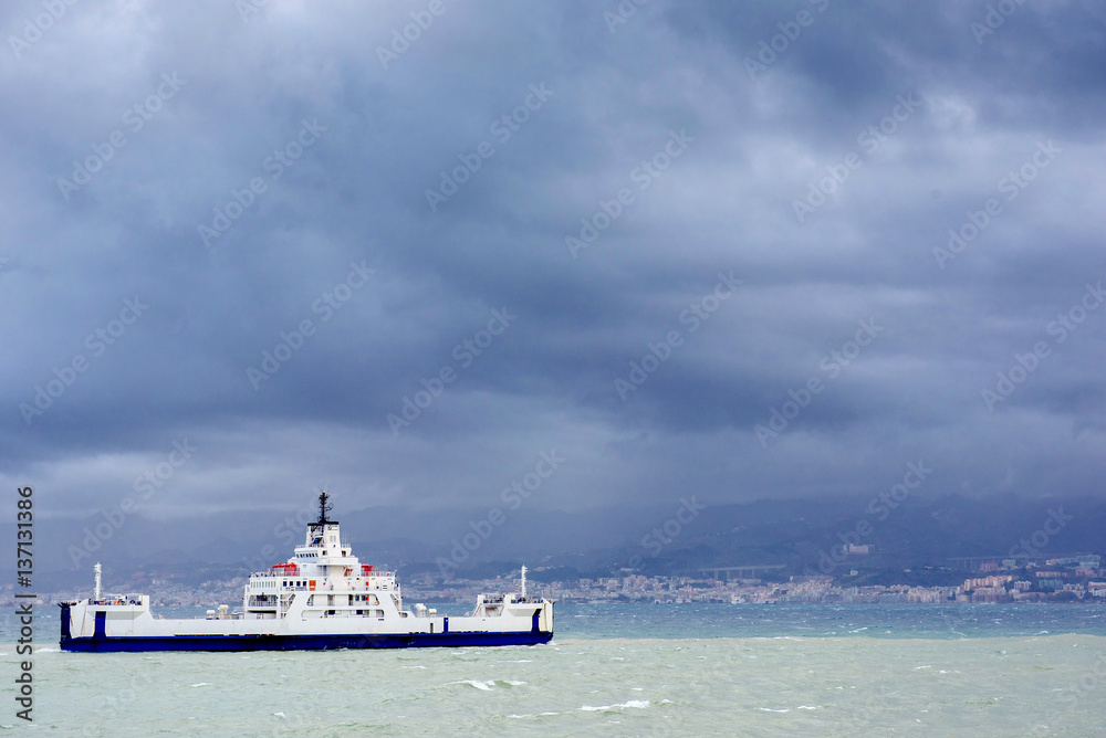 ship at sea under dramatic clouds Sicily Italy Europe