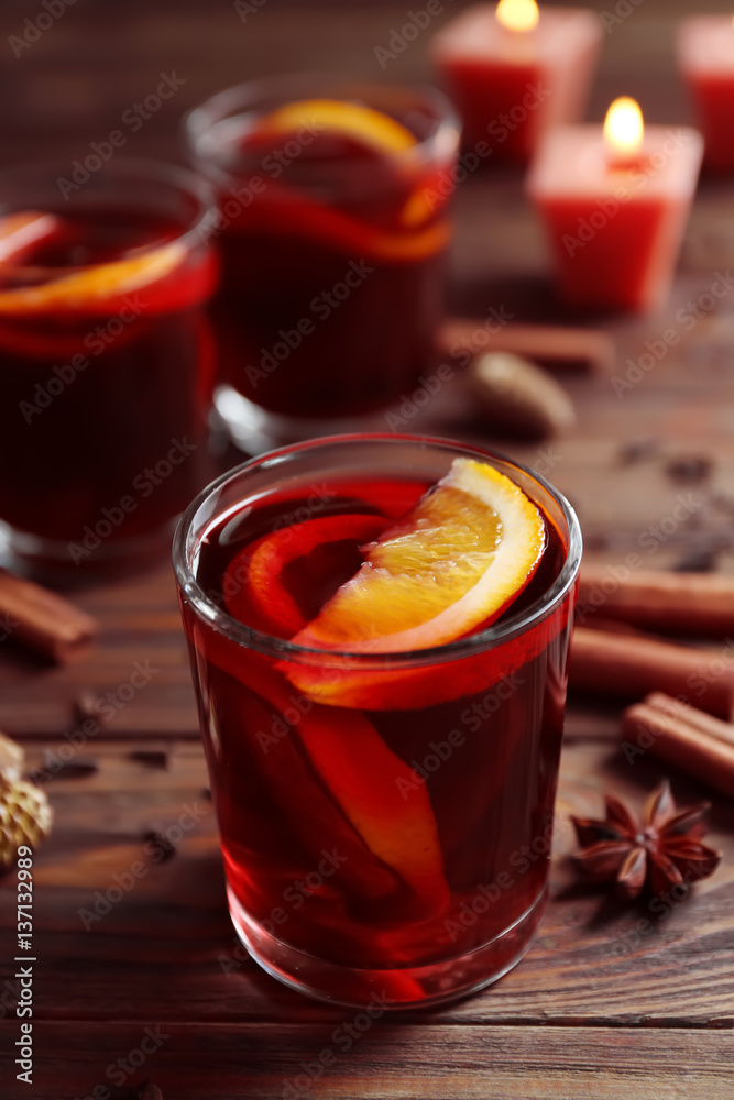 Glass of delicious Christmas mulled wine on wooden background, closeup Glass of delicious Christmas mulled wine on wooden background, closeup
