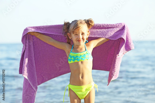 Cute girl wrapped in towel ...