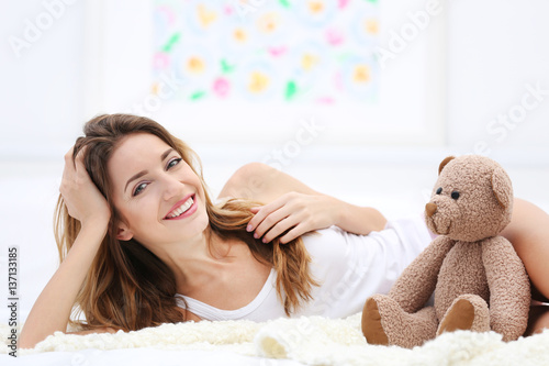 Young beautiful woman lying...
