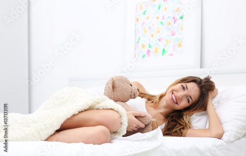 Young beautiful woman lying...