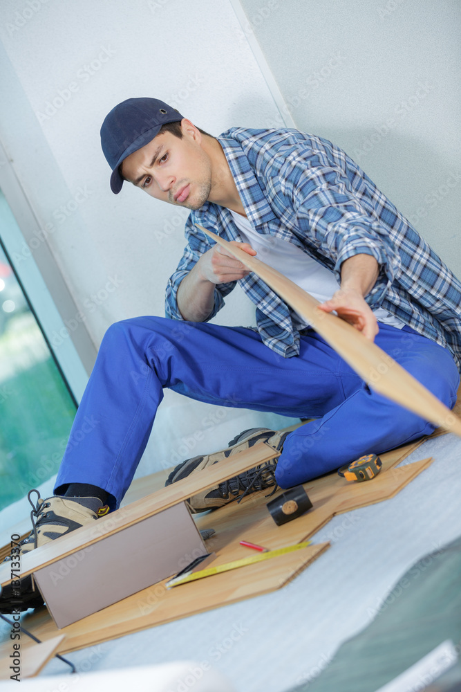young handyman in uniform Stock Photo | Adobe Stock