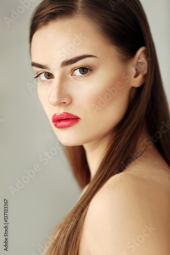 Portrait of beautiful young woman on color background  close up