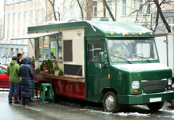 Food truck with people at Christmas fair