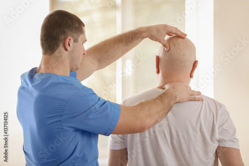 Physiotherapist working wit...