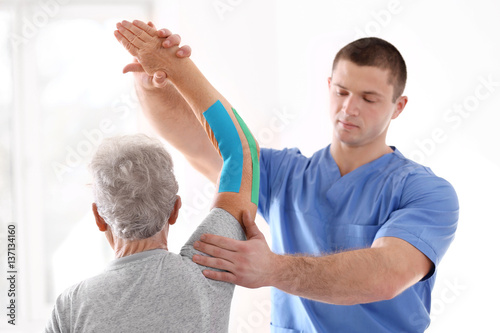 Physiotherapist working wit...