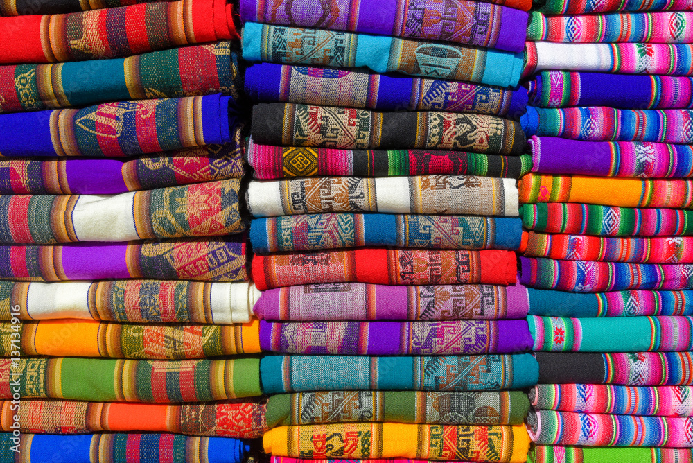 A pile of colorful rugged Peruvian textile and fabrics. A pile of colorful rugged Peruvian textile and fabrics.