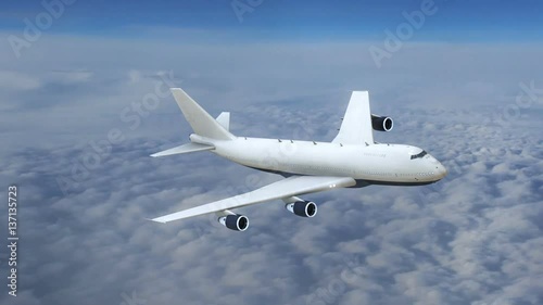 Plane flying above the clouds, commercial airplane in flight photo