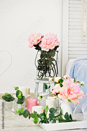 Peonies bouquets decorin a white room - greeting card photo