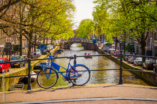 Bike on the bridge in Amsterdam, Netherlands. Canals of Amsterdam.