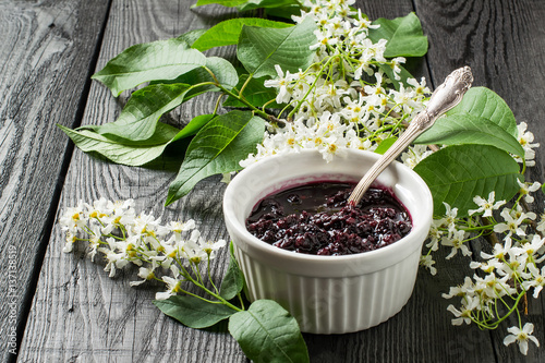 Medicinal plant bird cherry (flowering branches and jam) photo