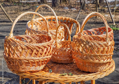 Trade of Handicrafts in the street in the spring. Wicker baskets and rattan furniture photo