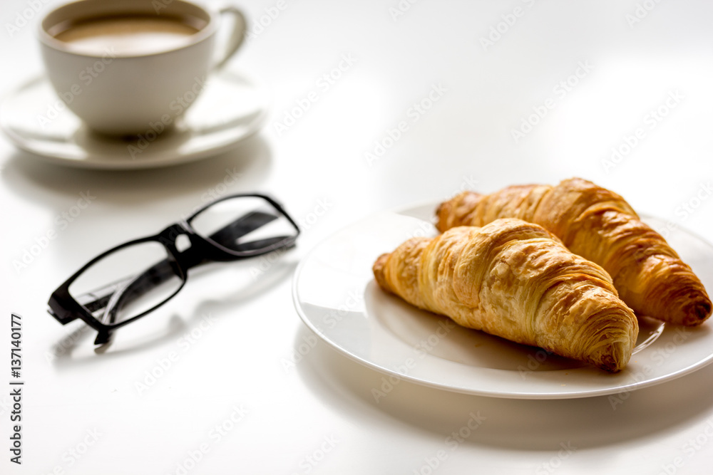 Business lunch with croissant on white table top view Business lunch with croissant on white table top view