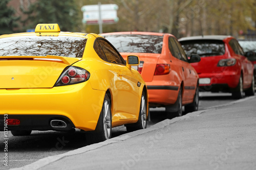 Closeup of yellow taxi cab in traffic jam