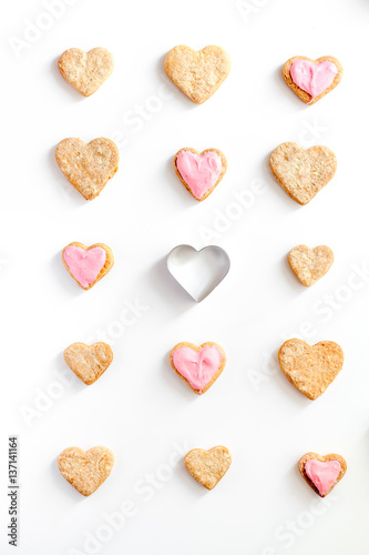 cookies for Valentine Day heartshaped white background top view pattern