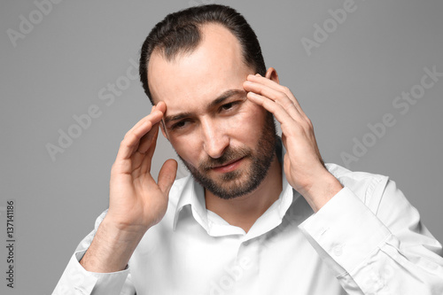Handsome man suffering from...