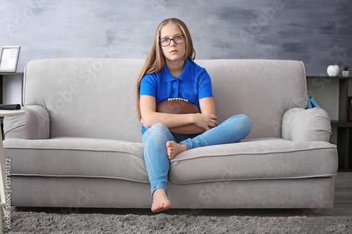 Pretty teenager watching ru...