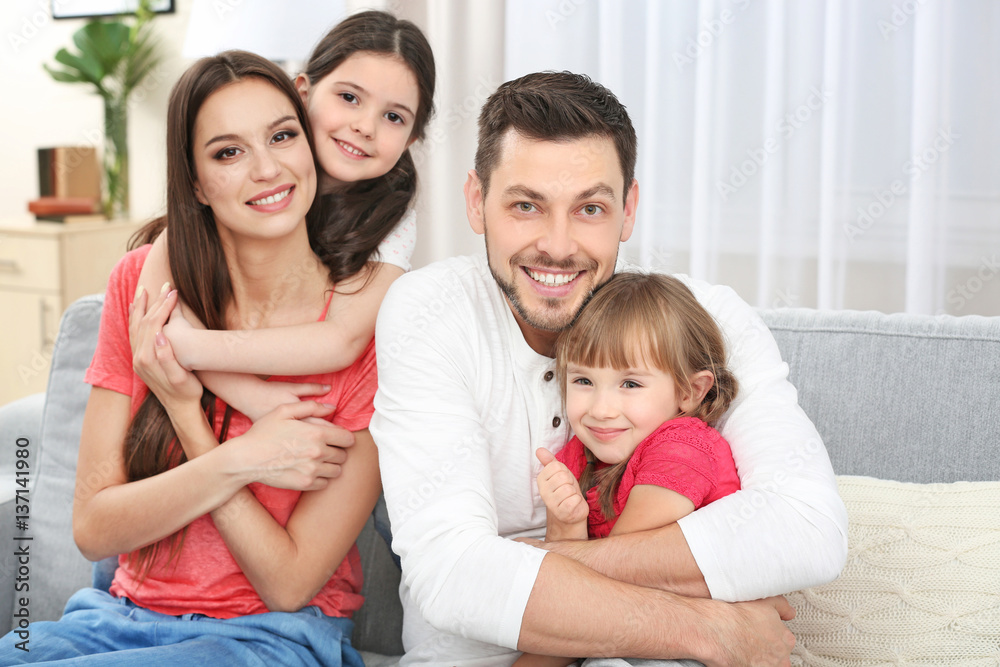 Happy family on sofa in the room