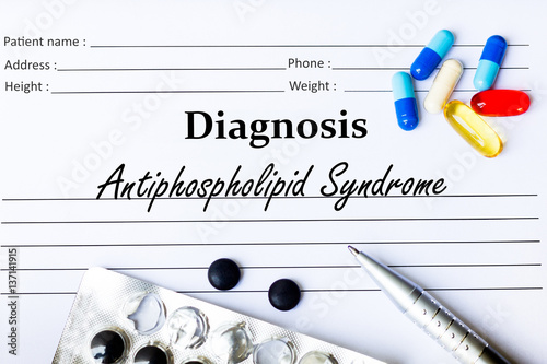 Antiphospholipid Syndrome - Diagnosis written on a piece of white paper with medication and Pills