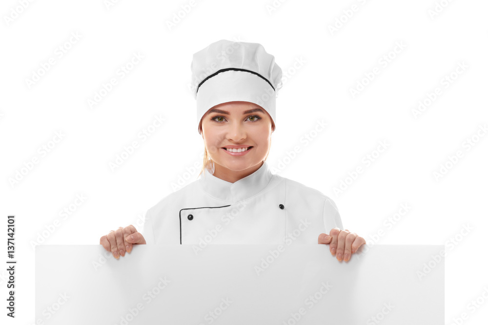 Young woman chef holding white blank banner isolated on white background Young woman chef holding white blank banner isolated on white background