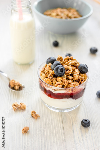 Healthy morning with granola breakfast on white kitchen table