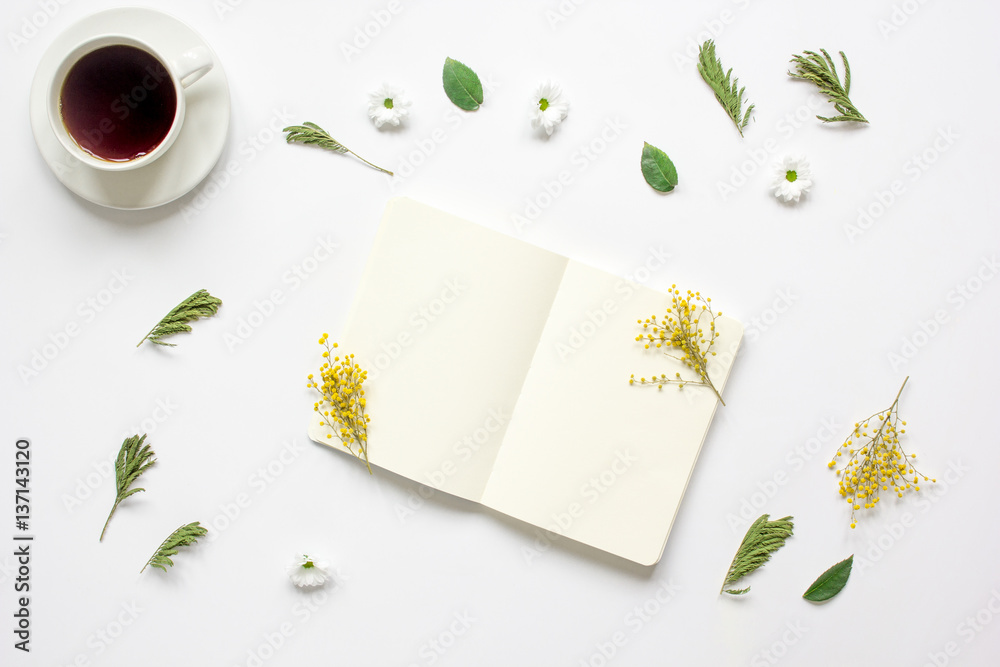 Notebook with cup of coffee on white background top view mockup Notebook with cup of coffee on white background top view mockup