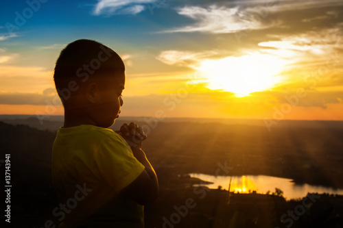 Boy praying on the Mount, thank God.