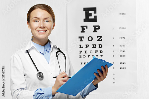 Young happy female doctor w...