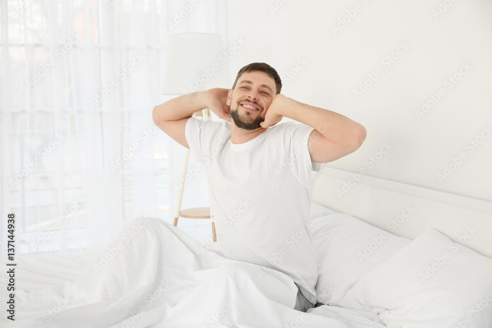 Young attractive man waking up in the morning Young attractive man waking up in the morning