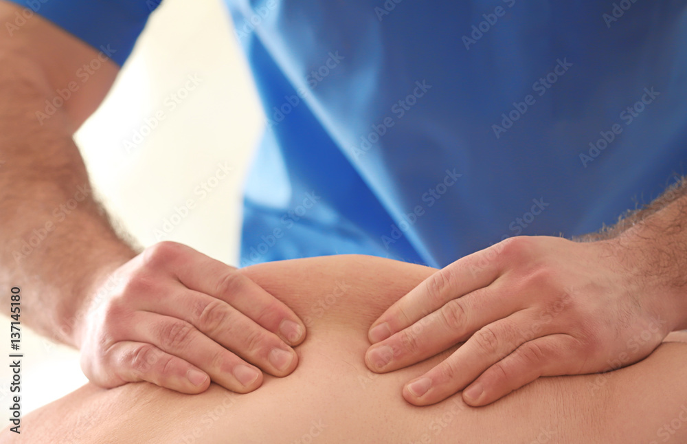 Physiotherapist working with elderly patient in clinic Physiotherapist working with elderly patient in clinic