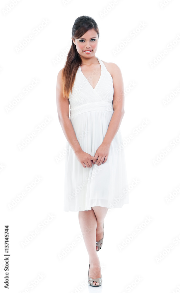 Young fashionable woman in white dress