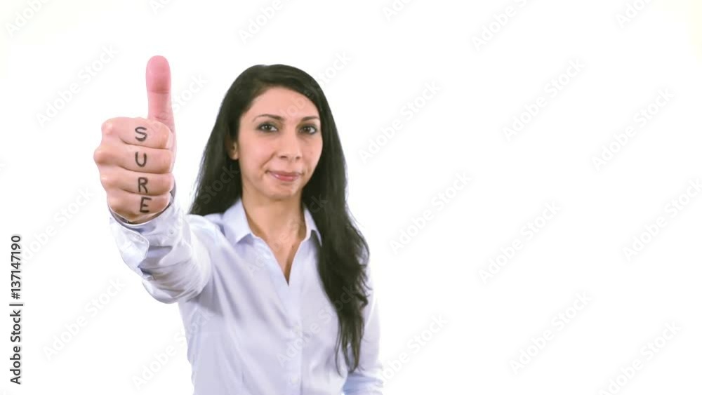 Caucasian businesswoman smiling happy giving thumb up with word SURE, business success hand indoor white background, soft focused woman Caucasian businesswoman smiling happy giving thumb up with word SURE, business success hand indoor white background, soft focused woman