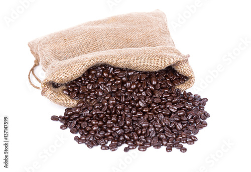 Coffee beans in burlap sack isolated on white © geargodz