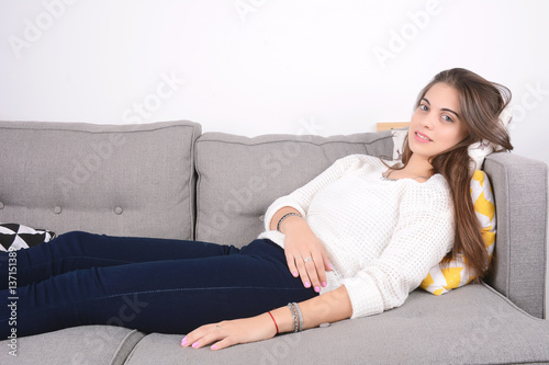 Woman lying on couch.