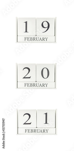 Closeup group of white wooden calendar with black 19 , 20 , 21 february word , three date calendar isolated on white background