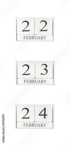 Closeup group of white wooden calendar with black 22 , 23 , 24 february word , three date calendar isolated on white background
