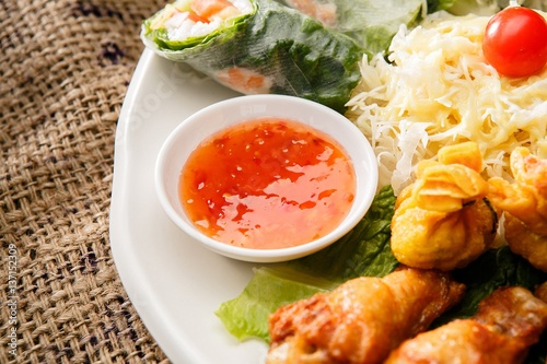 Fresh vegetables, various rolls of meat and crispy fried