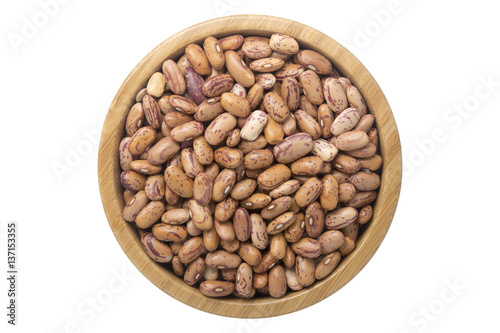 Indian kidney beans in wooden bowl isolated top view on white