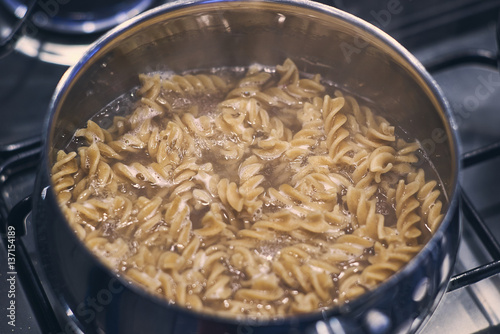 Boiling Wholemeal Pasta cooking in a saucepan on the stove