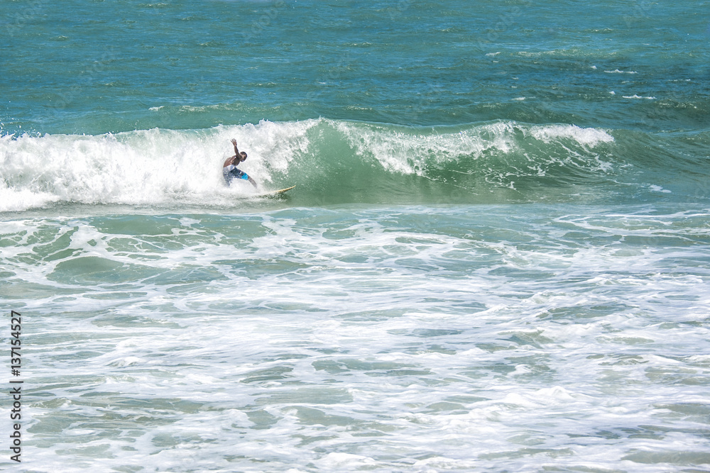 A man surfing a wave