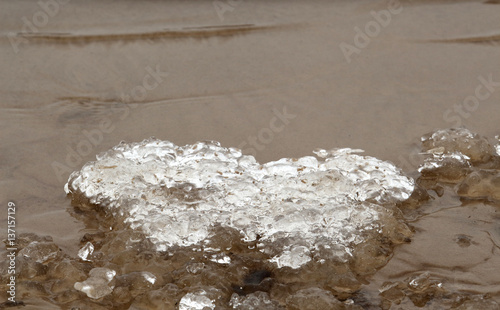 Riga Gulf coast during the winter.Ice and sand photo