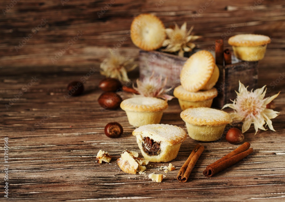small round Christmas cakes with nuts and cinnamon, space for text small round Christmas cakes with nuts and cinnamon, space for text