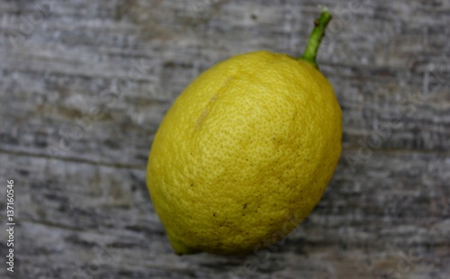 Mature lemon on wooden background  