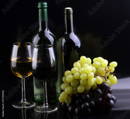 Wine glass and Bottle on black background. Red and white wine