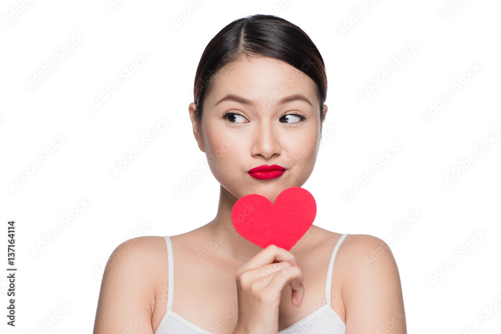 Attractive young woman with red heart. Valentine's day art portrait. Perfect make up Attractive young woman with red heart. Valentine's day art portrait. Perfect make up