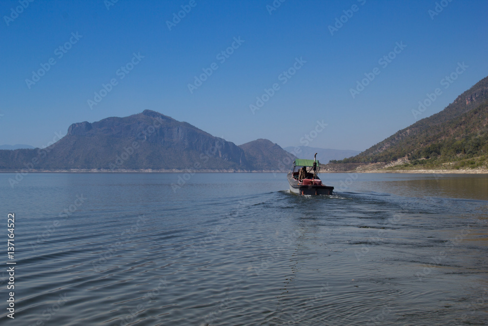 The Boat in Ping River, View of Bhumibol Dam, Tak province, Thailand.