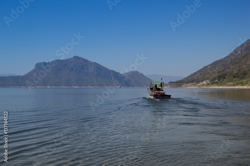 The Boat in Ping River, View of Bhumibol Dam, Tak province, Thailand.