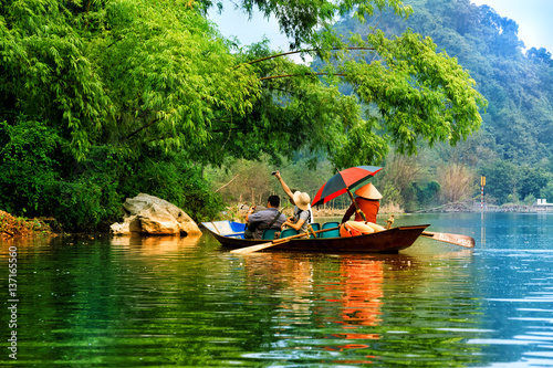 Traveling by boat on streams YEN in Hanoi, Vietnam.